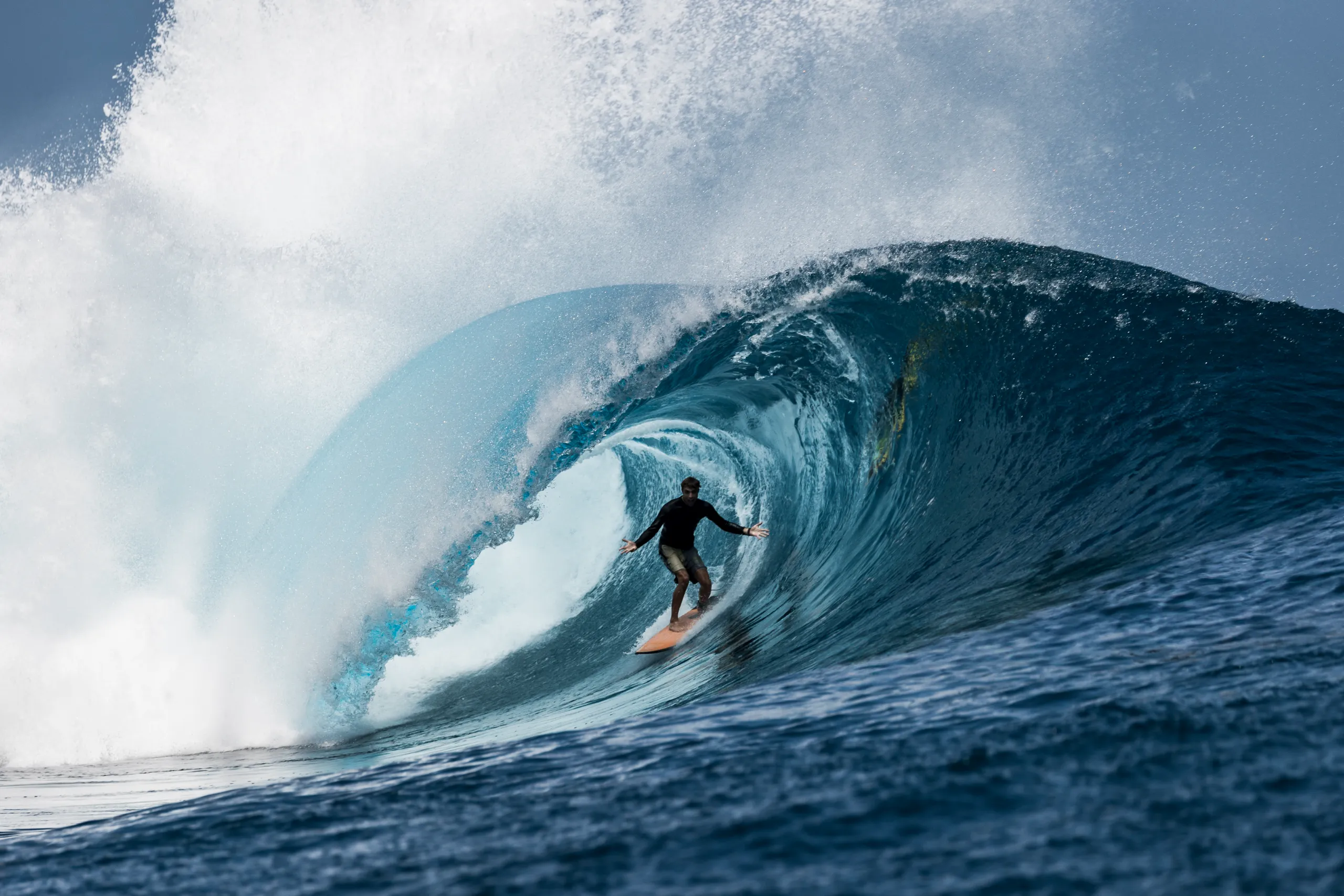 Surfer inside a breaking wave