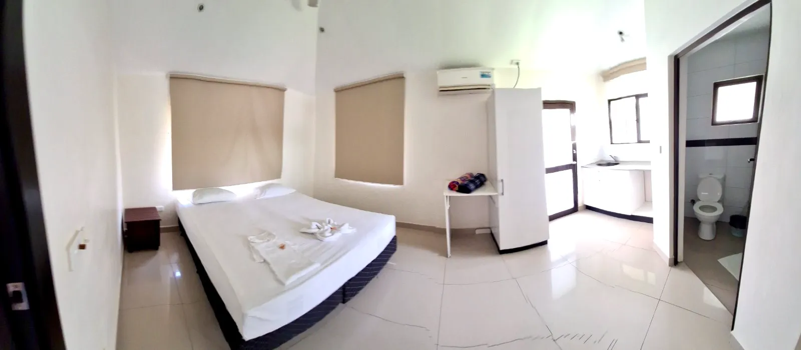 Villa bedroom with white bedding