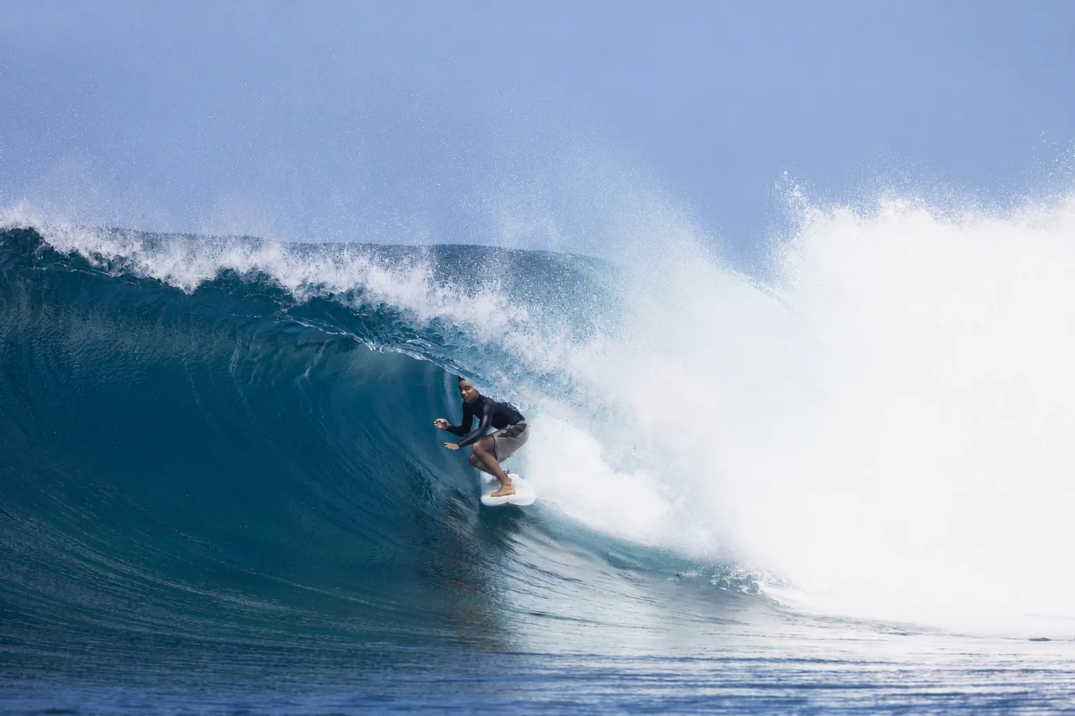Surfer riding a breaking wave